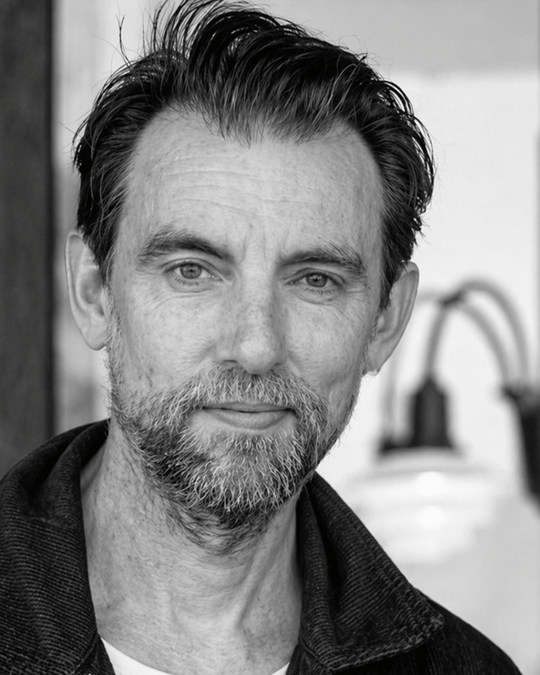 Portrait of Mads Wille in black and white, © 2025 Louis Poulsen.
