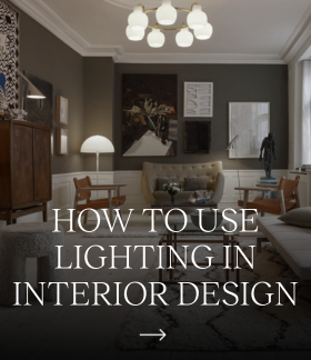 How to use lighting in interior design; a PH 1/1 Chandelier Centenary Edition illuminates a classic living room. © 2026 Louis Poulsen.