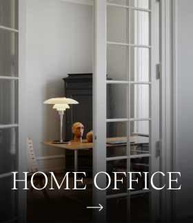 A PH 3/2 Table Lamp on a desk in a home office, with the words “Home Office” across the image. © 2026 Louis Poulsen.