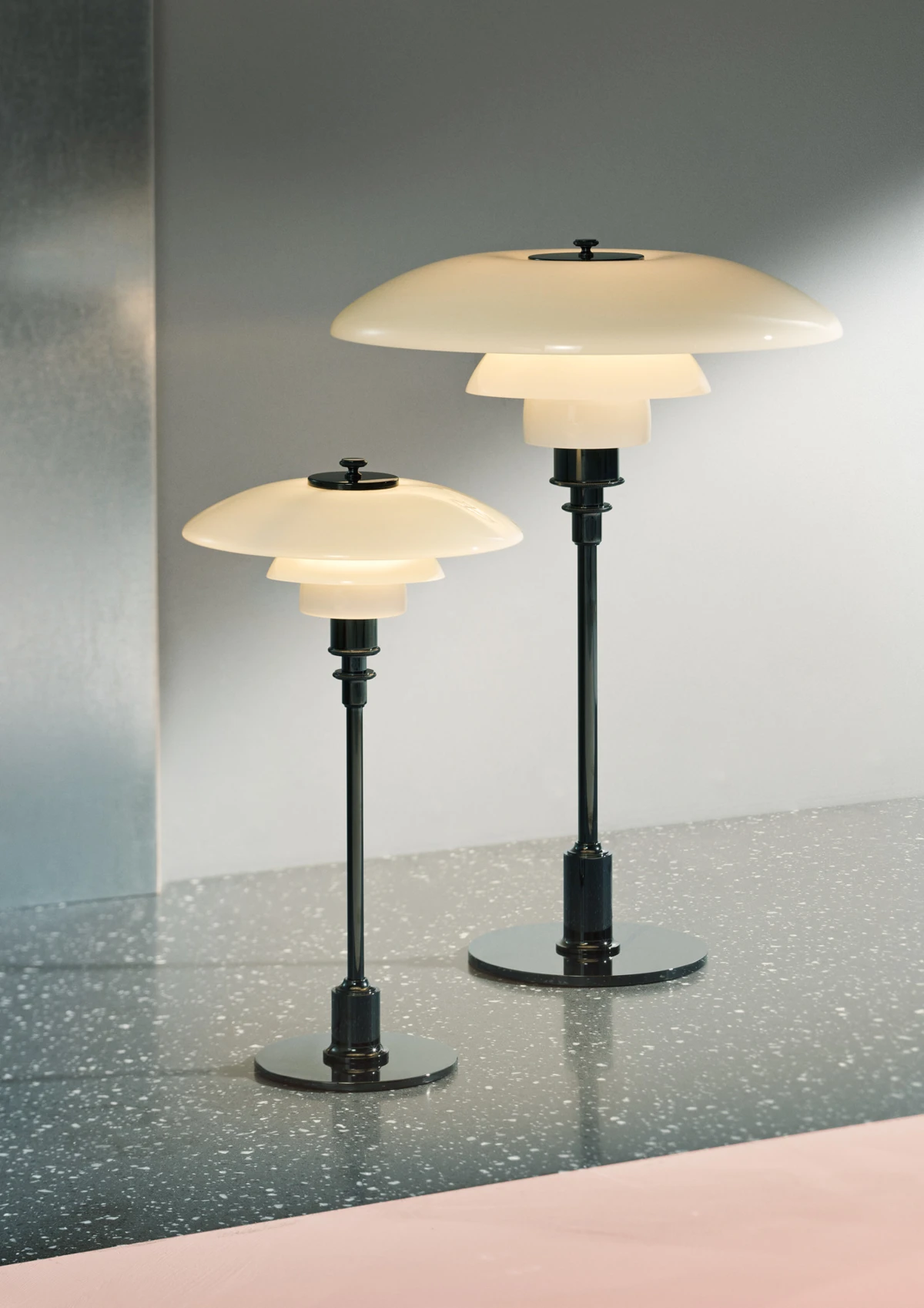 PH 2/1 table lamp & PH 3/2 Table lamp, on a terrazzo table, © 2025 Louis Poulsen.