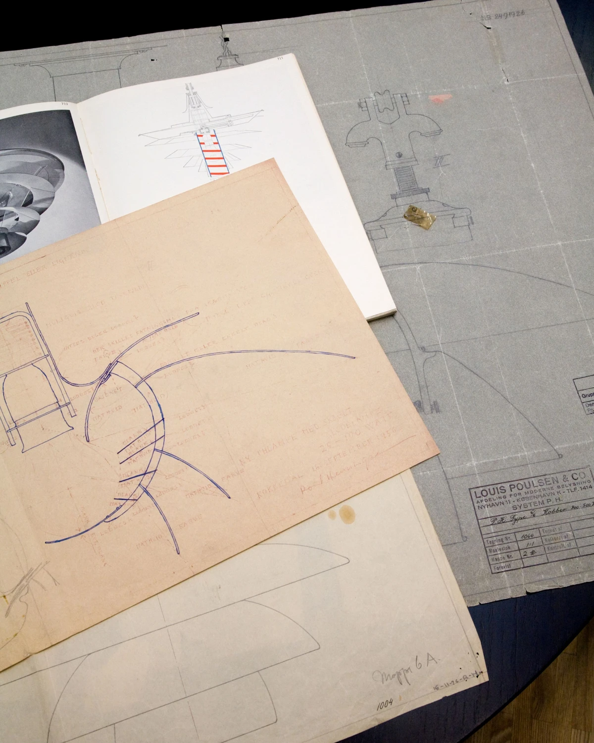 PH Artichoke pendant design drawings and technical sketches are spread across a table. © 2026 Louis Poulsen.